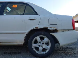 2001 Mazda Protege LX with VIN JM1BJ225710406286, listed as a IAAI auction lot 41887127 with Not Provided miles and . Bid and sale history available at DreamBid. Image 11.