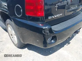 2006 GMC Envoy Denali with VIN 1GKES63M262344853, listed as a IAAI auction lot 42024960 with 183,066 mi miles. Bid and sale history available at carsss.com. Image 6.