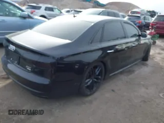 2016 Audi A8 L 4.0T Sport with VIN WAU43AFDXGN005323, listed as a IAAI auction lot 41311344 with 84,000 mi miles. Bid and sale history available at carsss.com. Image 4.