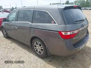2012 Honda Odyssey EX-L with VIN 5FNRL5H60CB054277, listed as a IAAI auction lot 42459861 with 205,722 mi miles and . Bid and sale history available at DreamBid. Image 3.
