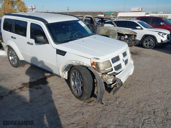 2011 Dodge Nitro Heat with VIN 1D4PT4GK0BW582589, listed as a IAAI auction lot 41015035 with 130,098 mi miles. Bid and sale history available at carsss.com. Image 1.