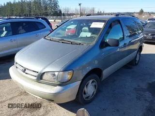 1999 Toyota Sienna LE with VIN 4T3ZF13C3XU103436, listed as a IAAI auction lot 41667242 with 228,318 mi miles. Bid and sale history available at carsss.com. Image 2.