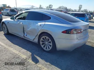 2017 Tesla Model S 60 with VIN 5YJSA1E12HF195741, listed as a IAAI auction lot 41861327 with 172,011 mi miles and . Bid and sale history available at DreamBid. Image 3.