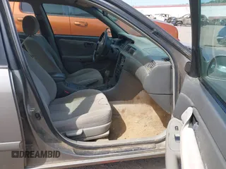 2001 Toyota Camry CE z VIN 4T1BG22K51U053555, wystawiony jako IAAI lot #42042788 z przebiegiem 279 347 mil mil oraz . Historia ofert i sprzedaży dostępna na DreamBid. Obrazek 5.