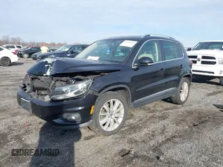 2012 Volkswagen Tiguan SE with VIN WVGAV7AX3CW531264, listed as a IAAI auction lot 41651242 with 190,669 mi miles and . Bid and sale history available at DreamBid. Image 2.