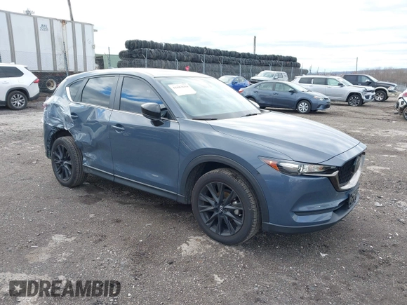 2021 Mazda CX-5 Touring with VIN JM3KFBCM5M0483547, listed as a IAAI auction lot 41683694 with 55,791 mi miles. Bid and sale history available at carsss.com. Image 1.