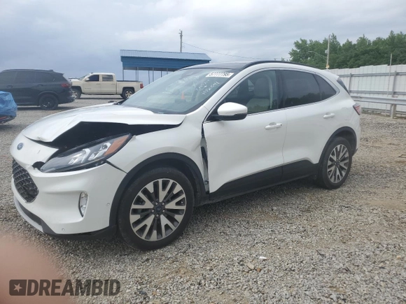 2020 Ford Escape Titanium z VIN 1FMCU9J9XLUB57675, wystawiony jako Copart lot #57777795 z przebiegiem Nie podano mil oraz Szkoda całkowita • Salvage title. Historia ofert i sprzedaży dostępna na DreamBid. Obrazek 1.