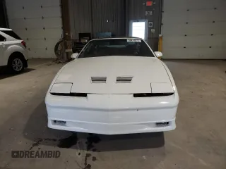 1989 Pontiac Firebird z VIN 1G2FW2180KL256119, wystawiony jako Copart lot #56474875 z przebiegiem 81 176 mil mil oraz Szkoda całkowita • Salvage title. Historia ofert i sprzedaży dostępna na DreamBid. Obrazek 5.