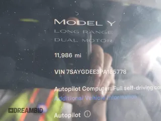 2023 Tesla Model Y Long Range with VIN 7SAYGDEE3PA185778, listed as a IAAI auction lot 39721611 with 11,986 mi miles and . Bid and sale history available at DreamBid. Image 15.