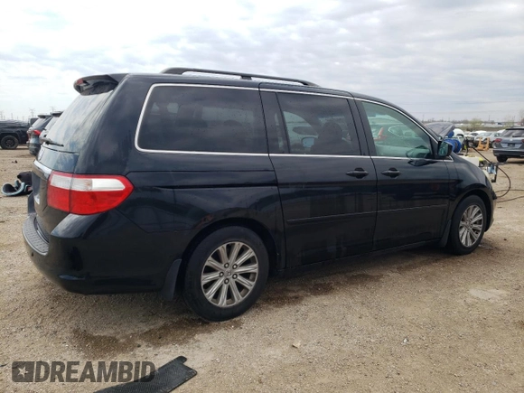 2007 Honda Odyssey Touring with VIN 5FNRL38847B022928, listed as a Copart auction lot 53869135 with 217,620 mi miles and Salvage Title. Bid and sale history available at DreamBid. Image 3.