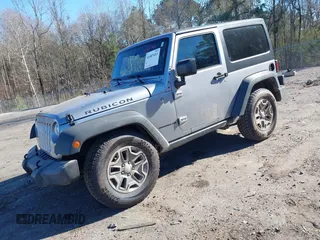 2016 Jeep Wrangler Rubicon z VIN 1C4BJWCGXGL307542, wystawiony jako IAAI lot #41407411 z przebiegiem 124 749 mil mil oraz . Historia ofert i sprzedaży dostępna na DreamBid. Obrazek 2.