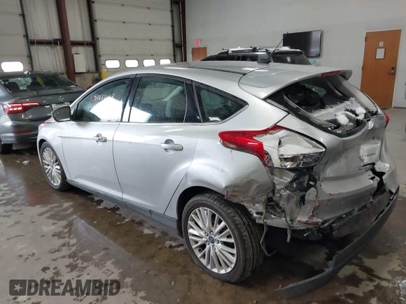 2018 Ford Focus Titanium with VIN 1FADP3N25JL261736, listed as a IAAI auction lot 41032128 with 59,142 mi miles and . Bid and sale history available at DreamBid. Image 3.