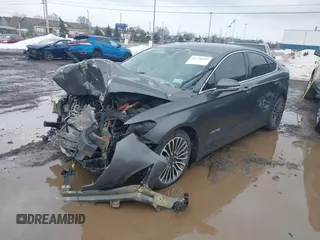 2017 Ford Fusion Hybrid Titanium z VIN 3FA6P0RU6HR279726, wystawiony jako IAAI lot #41736889 z przebiegiem 123 698 mil mil oraz . Historia ofert i sprzedaży dostępna na DreamBid. Obrazek 2.