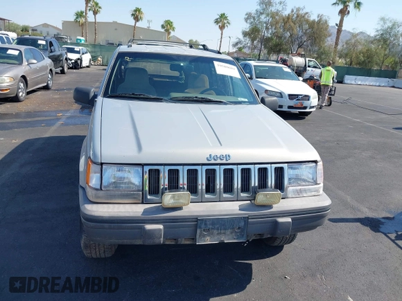 1994 Jeep Grand Cherokee Laredo with VIN 1J4GZ58S4RC325909, listed as a IAAI auction lot 39580601 with 162,952 mi miles. Bid and sale history available at carsss.com. Image 6.