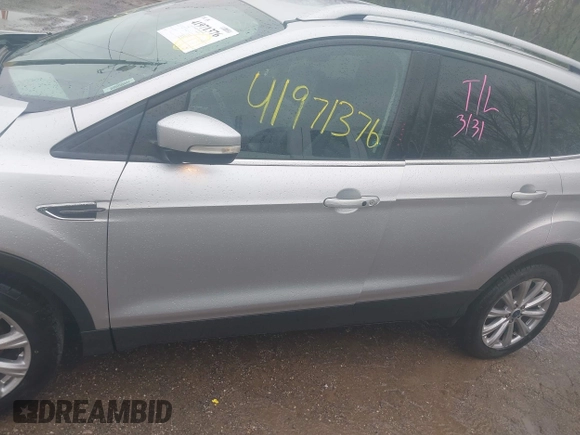 2017 Ford Escape Titanium with VIN 1FMCU0J96HUC21987, listed as a IAAI auction lot 41971376 with 97,488 mi miles and . Bid and sale history available at DreamBid. Image 14.