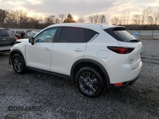 2020 Mazda CX-5 Touring with VIN JM3KFACM0L0863937, listed as a Copart auction lot 48240655 with 70,592 mi miles and Salvage Title. Bid and sale history available at carsss.com. Image 2.