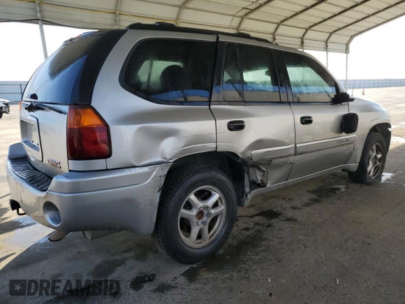 2005 GMC Envoy SLE with VIN 1GKDS13S852374516, listed as a Copart auction lot 42409725 with 299,816 mi miles and Salvage Title. Bid and sale history available at carsss.com. Image 3.