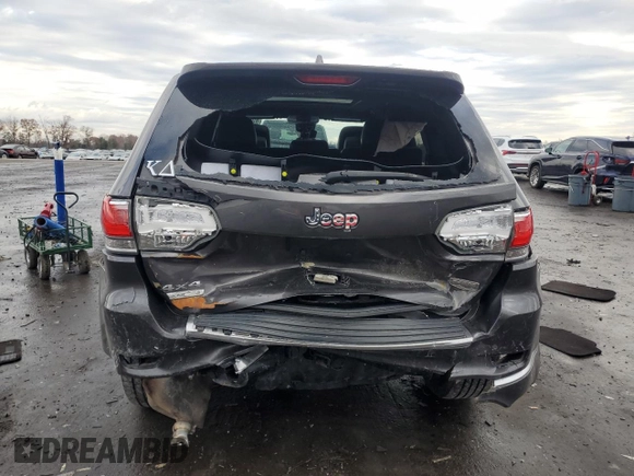 2015 Jeep Grand Cherokee Summit with VIN 1C4RJFJM7FC928257, listed as a Copart auction lot 82525714 with 148,208 mi miles and Salvage Title. Bid and sale history available at carsss.com. Image 6.