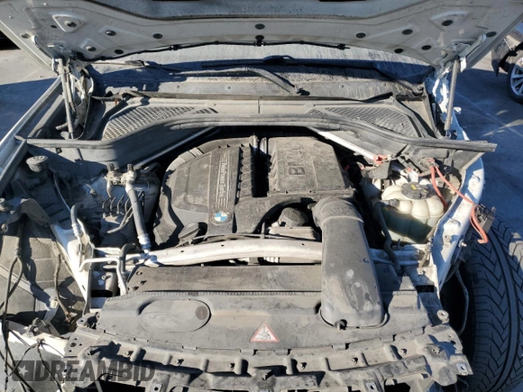 2016 BMW X6 sDrive35i with VIN 5UXKU0C56G0F92990, listed as a Copart auction lot 77191074 with 194,077 mi miles and Salvage Title. Bid and sale history available at carsss.com. Image 12.