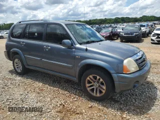 2005 Suzuki XL7 LX z VIN JS3TY92VX54102488, wystawiony jako Copart lot #56700595 z przebiegiem 169 827 mil mil oraz Szkody całkowita. Historia ofert i sprzedaży dostępna na DreamBid. Obrazek 4.