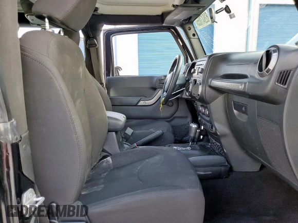 2015 Jeep Wrangler Freedom Edition with VIN 1C4AJWAG8FL541675, listed as a Copart auction lot 62647855 with 53,915 mi miles and Salvage title. Bid and sale history available at DreamBid. Image 7.