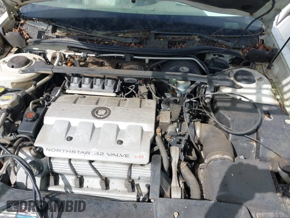 1999 Cadillac DeVille z VIN 1G6KD54Y5XU780836, wystawiony jako IAAI lot #41986180 z przebiegiem Nie podano mil oraz . Historia ofert i sprzedaży dostępna na DreamBid. Obrazek 10.
