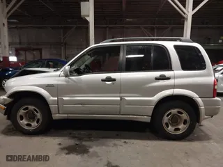 2002 Suzuki Grand Vitara JLX with VIN JS3TD62V324161291, listed as a IAAI auction lot 41577344 with 164,658 mi miles. Bid and sale history available at carsss.com. Image 14.