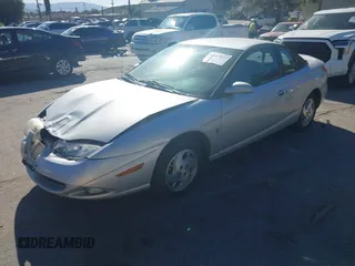 2002 Saturn SC with VIN 1G8ZY14732Z144888, listed as a IAAI auction lot 41617831 with 138,564 mi miles. Bid and sale history available at carsss.com. Image 2.