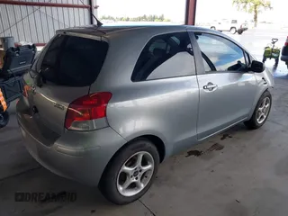 2009 Toyota Yaris with VIN JTDJT903095254673, listed as a IAAI auction lot 41830459 with 320,449 mi miles. Bid and sale history available at carsss.com. Image 4.