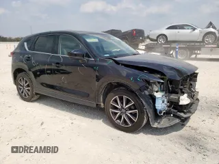 2018 Mazda CX-5 Grand Touring with VIN JM3KFBDM6J0414523, listed as a Copart auction lot 57581145 with 69,353 mi miles and Salvage title. Bid and sale history available at DreamBid. Image 4.