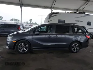 2019 Honda Odyssey Touring z VIN 5FNRL6H88KB037149, wystawiony jako IAAI lot #42356871 z przebiegiem 64 549 mil mil oraz . Historia ofert i sprzedaży dostępna na DreamBid. Obrazek 14.