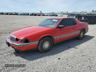 1992 Cadillac Eldorado z VIN 1G6EL13BXNU613746, wystawiony jako Copart lot #53699085 z przebiegiem 147 655 mil mil oraz Szkoda całkowita • Salvage title. Historia ofert i sprzedaży dostępna na DreamBid. Obrazek 1.