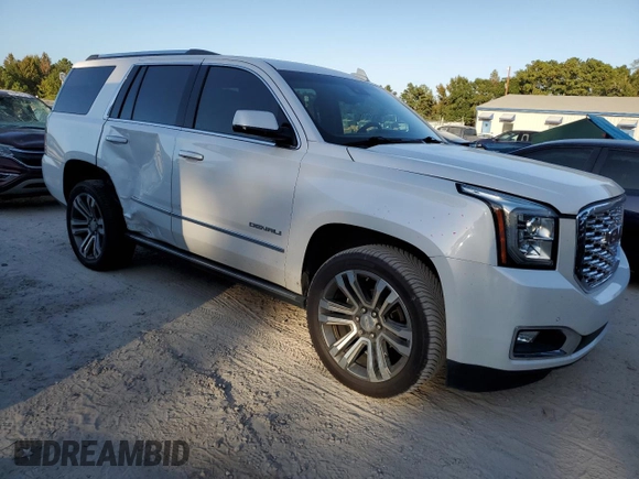2019 GMC Yukon Denali with VIN 1GKS1CKJ8KR353280, listed as a Copart auction lot 77316454 with 74,476 mi miles and Salvage Title. Bid and sale history available at carsss.com. Image 4.