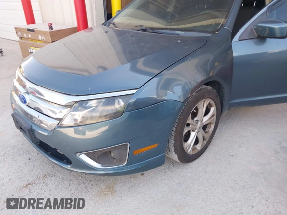 2012 Ford Fusion SE z VIN 3FAHP0HG6CR170633, wystawiony jako IAAI lot #42770990 z przebiegiem 233 383 mil mil oraz . Historia ofert i sprzedaży dostępna na DreamBid. Obrazek 6.