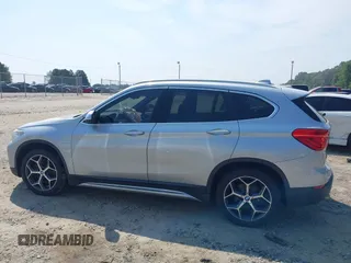 2018 BMW X1 xDrive28i with VIN WBXHT3C39J5L27926, listed as a IAAI auction lot 42582330 with 101,197 mi miles and . Bid and sale history available at DreamBid. Image 14.