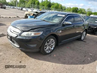 2012 Ford Taurus Limited z VIN 1FAHP2FW6CG136463, wystawiony jako Copart lot #57159005 z przebiegiem 124 833 mil mil oraz Szkoda całkowita • Salvage title. Historia ofert i sprzedaży dostępna na DreamBid. Obrazek 1.