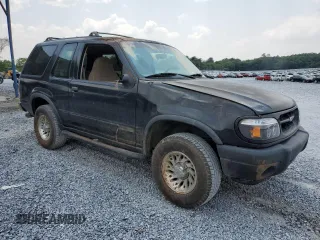 2000 Ford Explorer Sport with VIN 1FMYU60E8YUB03494, listed as a Copart auction lot 59266395 with 210,925 mi miles and Salvage title. Bid and sale history available at DreamBid. Image 4.