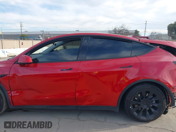 2023 Tesla Model Y Long Range with VIN 7SAYGAEE7PF713761, listed as a IAAI auction lot 41638067 with 46,089 mi miles and . Bid and sale history available at DreamBid. Image 14.