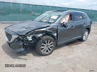 2016 Mazda CX-9 Grand Touring with VIN JM3TCBDY3G0117802, listed as a IAAI auction lot 42150821 with 157,760 mi miles and . Bid and sale history available at DreamBid. Image 2.