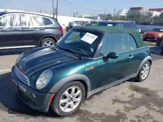 2006 MINI Convertible with VIN WMWRF33566TG15710, listed as a IAAI auction lot 41636955 with Not Provided miles and . Bid and sale history available at DreamBid. Image 2.