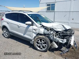 2015 Ford Escape Titanium with VIN 1FMCU0J98FUB63295, listed as a IAAI auction lot 42007554 with 137,061 mi miles and . Bid and sale history available at DreamBid. Image 1.