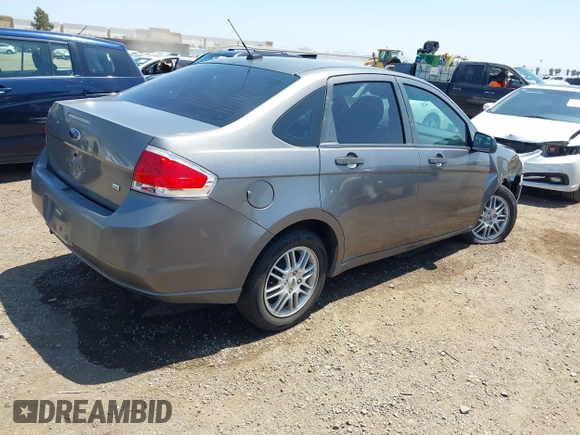 2009 Ford Focus SE with VIN 1FAHP35N69W244451, listed as a IAAI auction lot 42104982 with 199,524 mi miles. Bid and sale history available at carsss.com. Image 4.