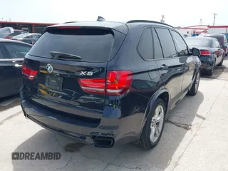 2014 BMW X5 xDrive50i with VIN 5UXKR6C55E0C03743, listed as a IAAI auction lot 42268302 with 118,892 mi miles and . Bid and sale history available at DreamBid. Image 4.