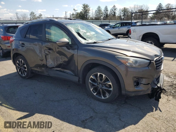 2016 Mazda CX-5 Grand Touring with VIN JM3KE4DY1G0806674, listed as a Copart auction lot 50549465 with 139,753 mi miles and Salvage Title. Bid and sale history available at carsss.com. Image 4.