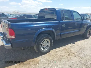 2002 Dodge Dakota SLT with VIN 1B7HL48N32S708719, listed as a IAAI auction lot 42027763 with 217,797 mi miles. Bid and sale history available at carsss.com. Image 4.