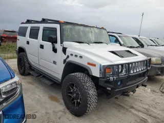 2005 Hummer H2 SUV with VIN 5GRGN23UX5H116341, listed as a Copart auction lot 76877704 with 145,778 mi miles and Salvage Title. Bid and sale history available at carsss.com. Image 4.