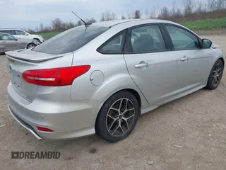 2016 Ford Focus SE with VIN 1FADP3F20GL228831, listed as a IAAI auction lot 42115033 with 106,975 mi miles. Bid and sale history available at carsss.com. Image 4.