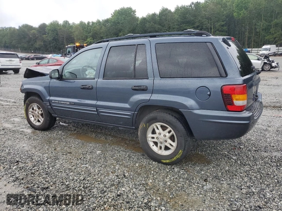 2004 Jeep Grand Cherokee Laredo with VIN 1J4GX48SX4C201569, listed as a Copart auction lot 58631585 with 271,124 mi miles and Salvage title. Bid and sale history available at DreamBid. Image 2.