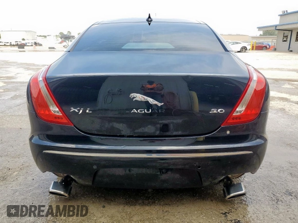 2014 Jaguar XJ Portfolio with VIN SAJWA2GZ2E8V64993, listed as a Copart auction lot 88774965 with 78,689 mi miles and Salvage title. Bid and sale history available at DreamBid. Image 6.
