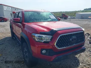 2018 Toyota Tacoma SR with VIN 3TMCZ5AN7JM168646, listed as a IAAI auction lot 42052795 with 104,497 mi miles and . Bid and sale history available at DreamBid. Image 1.